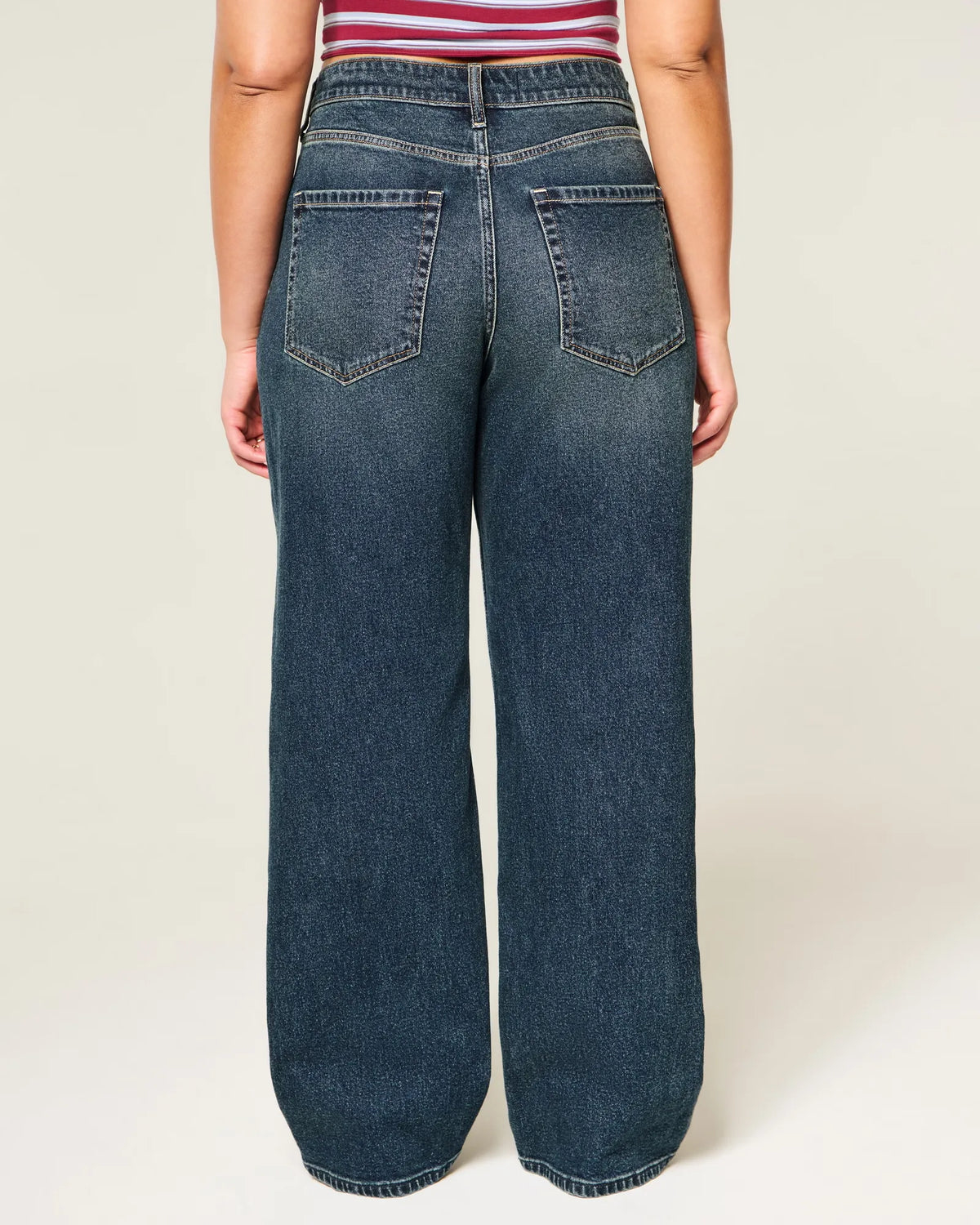 Jeans anchos de tiro alto con lavado oscuro y curvas