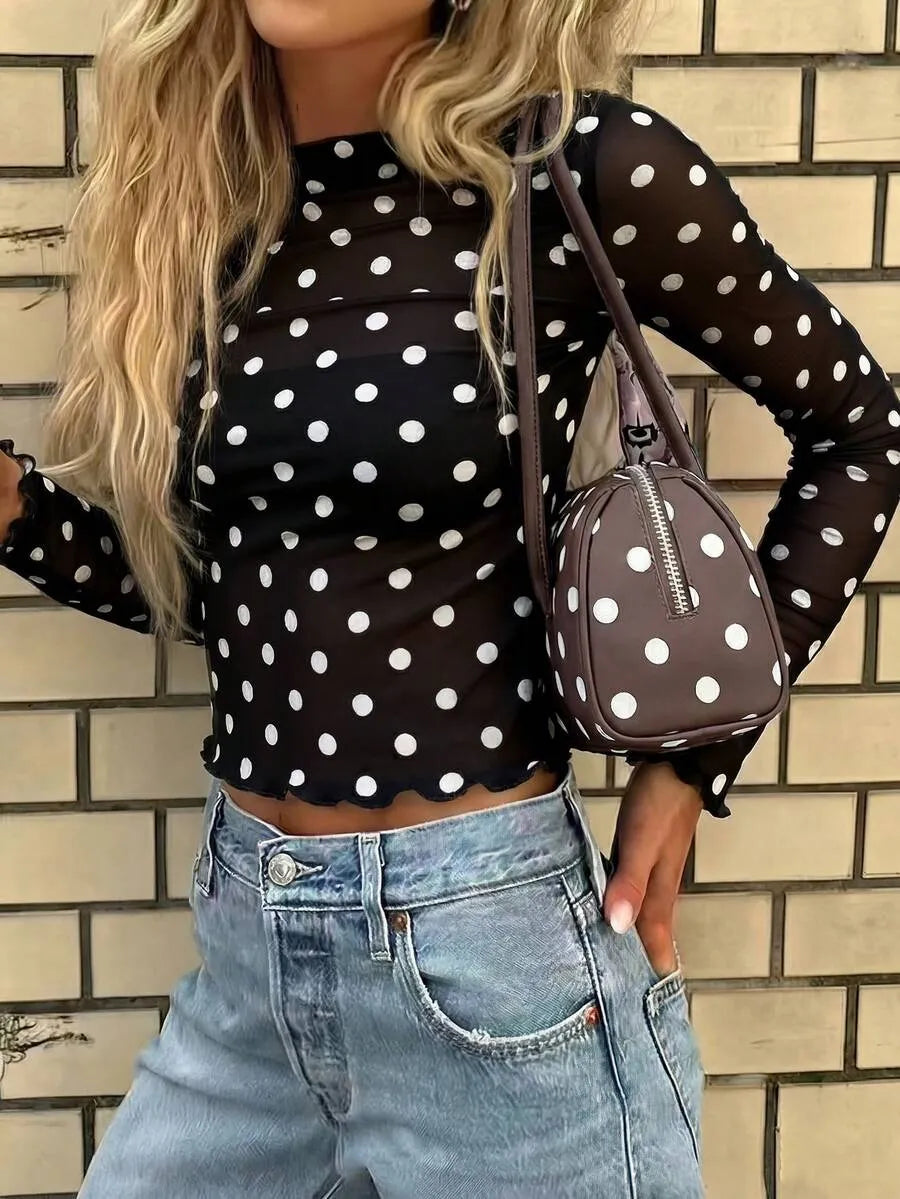 Blusa semitransparente con diseño de lunares