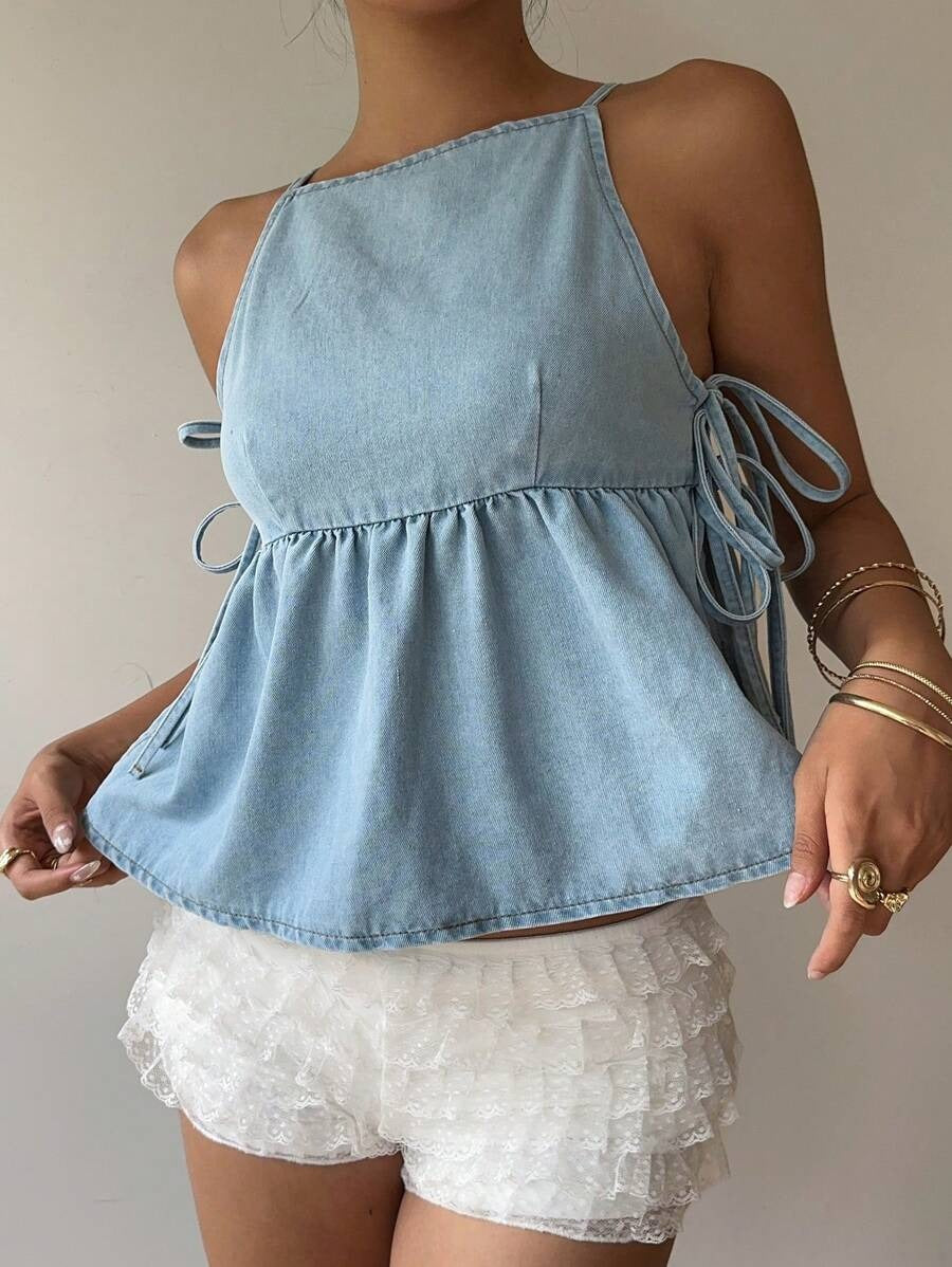 Top denim con lazos laterales