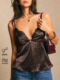 Blusa con diseño de lunares y encaje