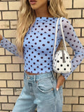 Blusa semitransparente con diseño de lunares