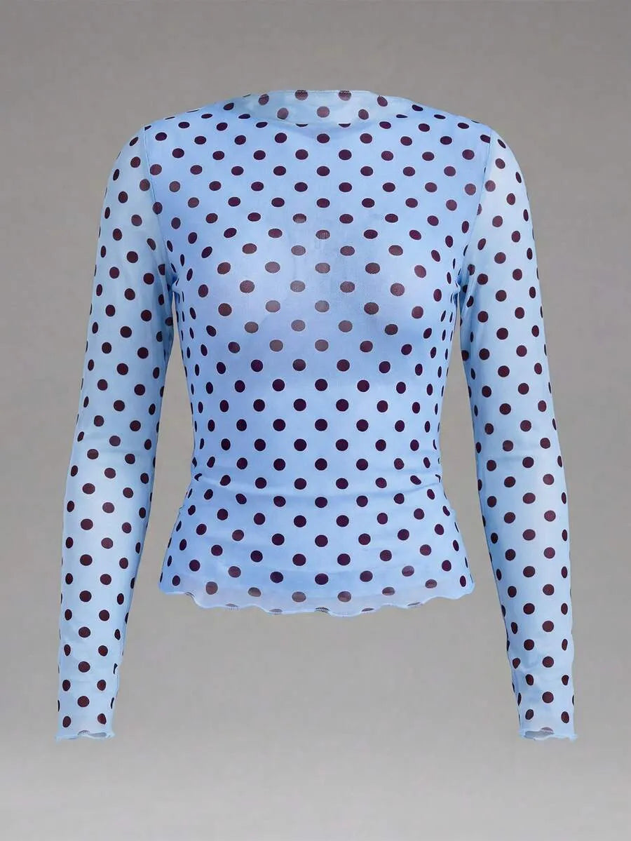 Blusa semitransparente con diseño de lunares