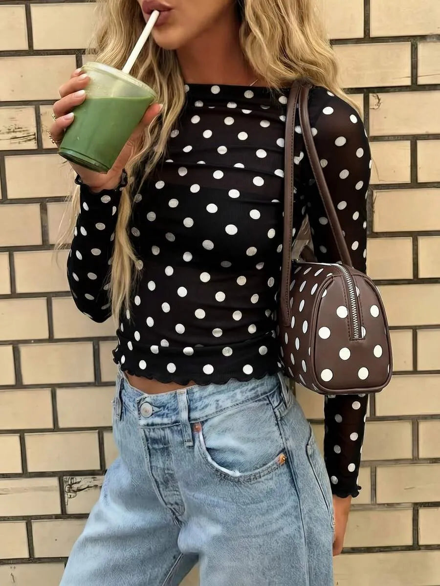 Blusa semitransparente con diseño de lunares