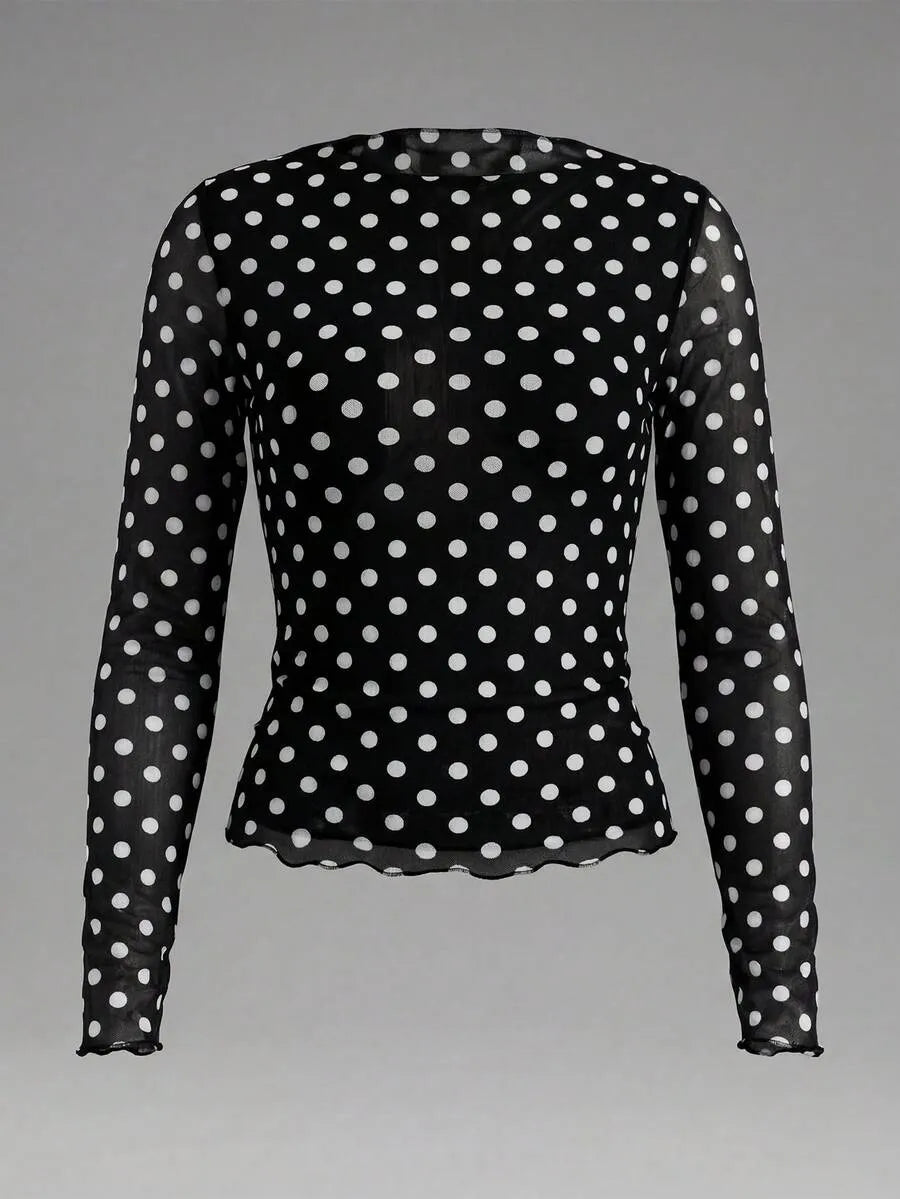 Blusa semitransparente con diseño de lunares