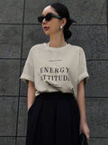 Camiseta de hombro caído con estampado