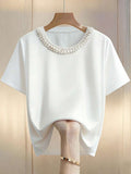 Blusa con decoracion de perlas en el cuello