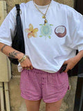 Camiseta oversize con diseños tropicales