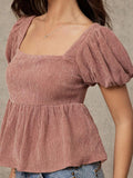 Blusa con volante