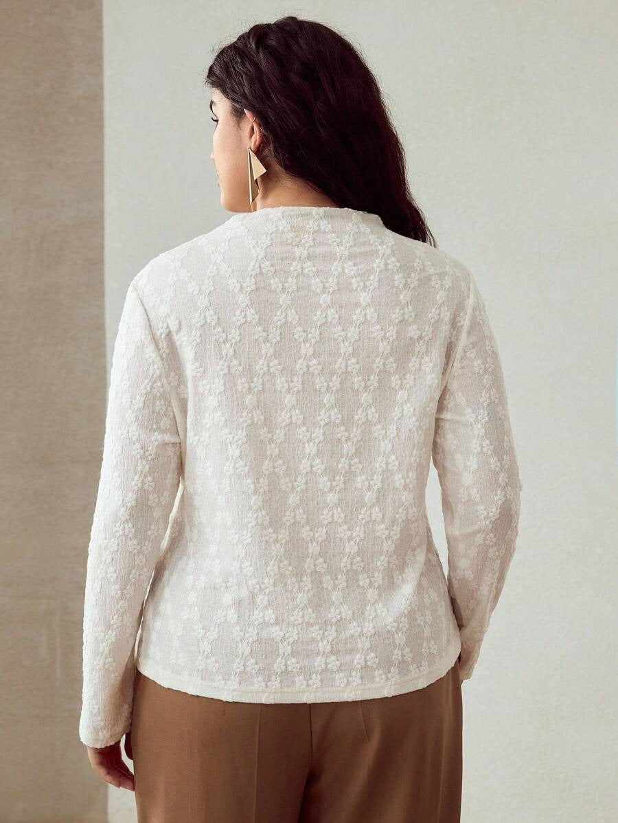 Blusa elegante de manga larga texturizada