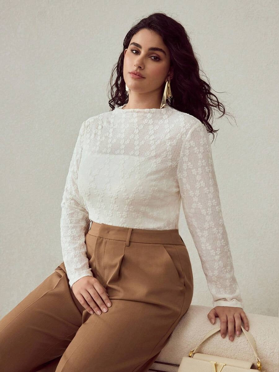 Blusa elegante de manga larga texturizada