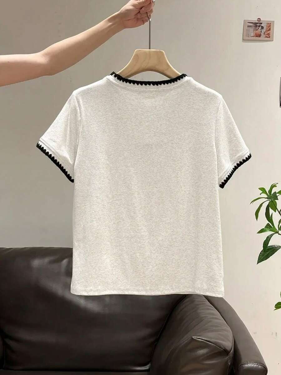 Blusa cuello v con ribete de constraste