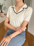 Blusa con solapa y ribete