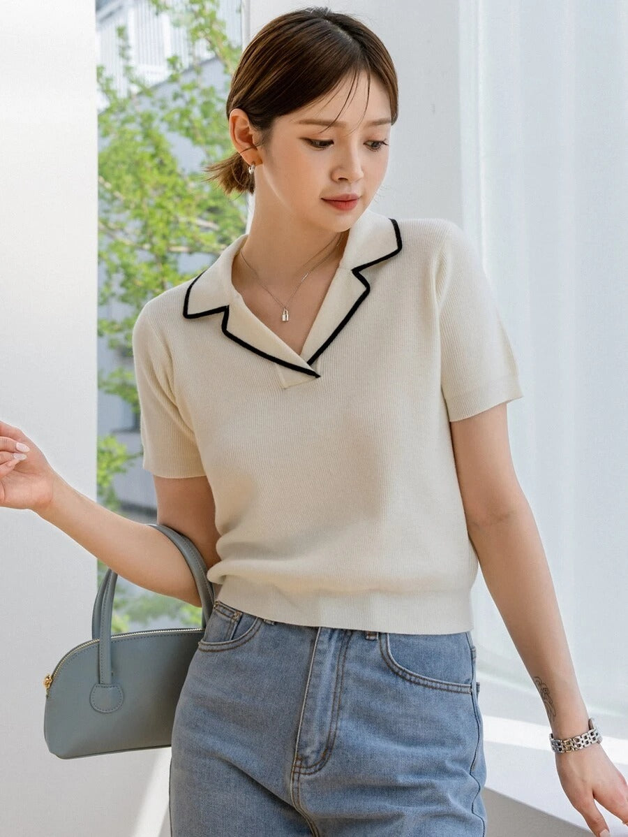 Blusa con solapa y ribete