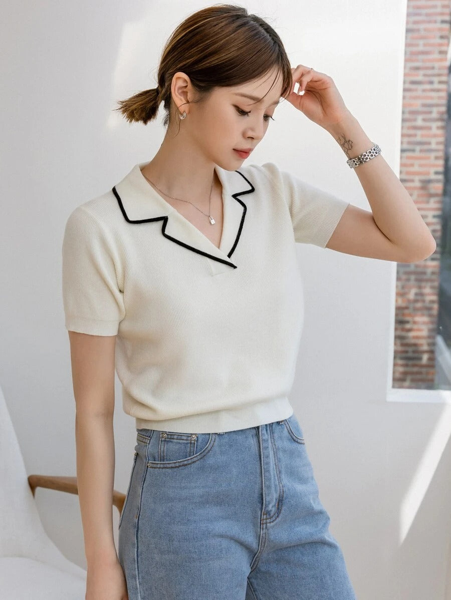 Blusa con solapa y ribete