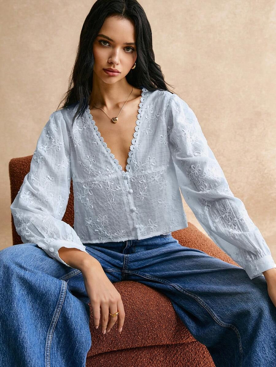 Blusa de manga larga con encaje floral