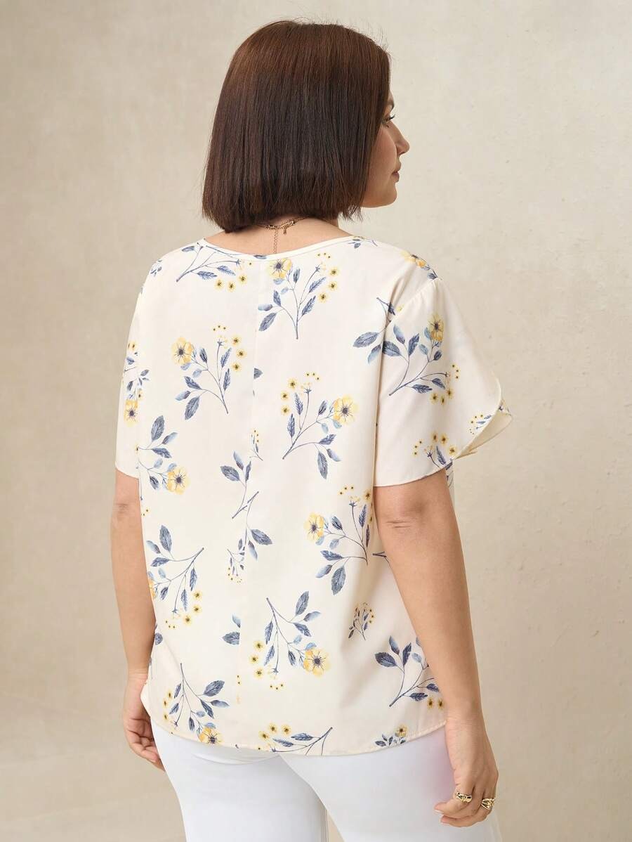 Blusa floreada con cremallera