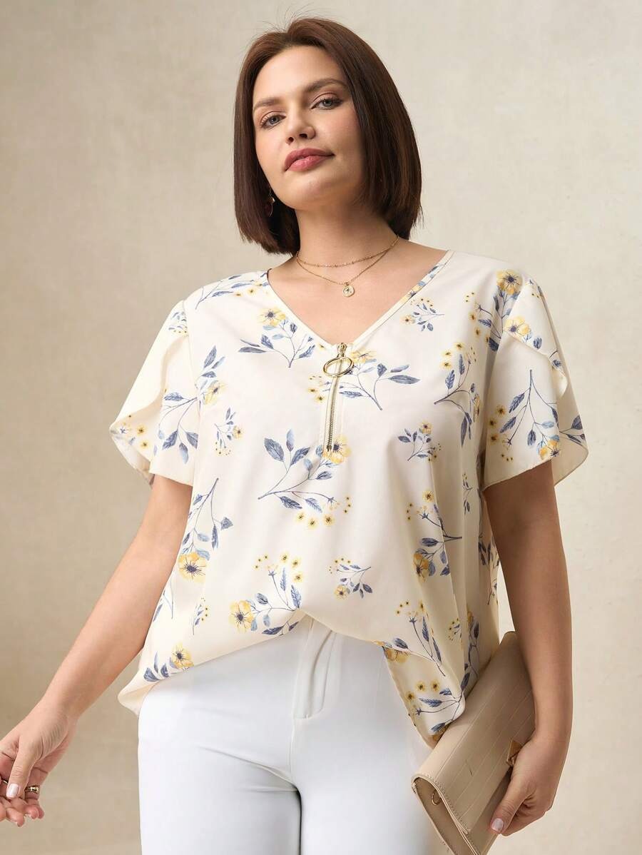 Blusa floreada con cremallera
