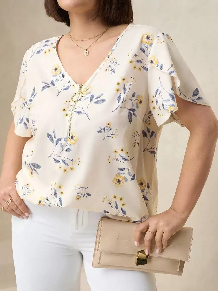Blusa floreada con cremallera