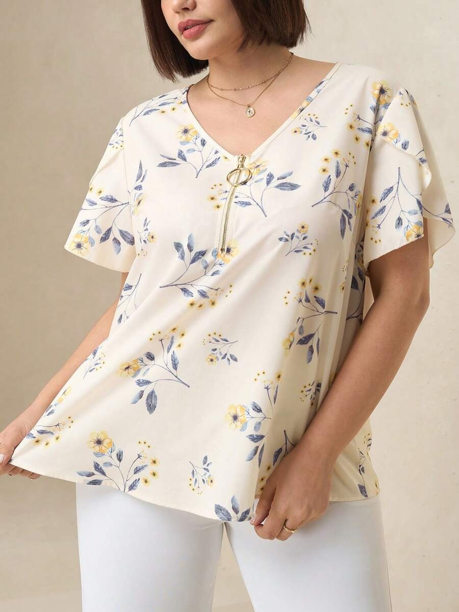 Blusa floreada con cremallera