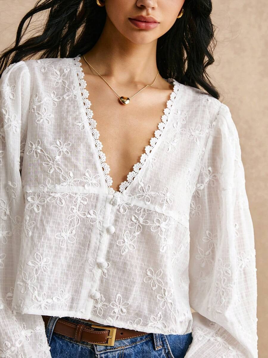 Blusa de manga larga con encaje floral