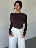 Body con espalda descubierta y botones metálicos